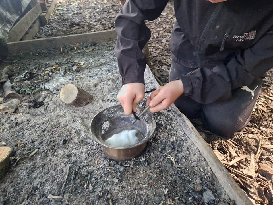 Preparing food outdoors during Fern Outdoor Adventures session